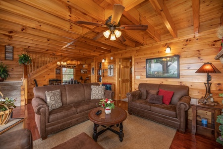 Living room with sofa and loveseat at 1 Above the Smokies, a 2 bedroom cabin rental located in Pigeon Forge