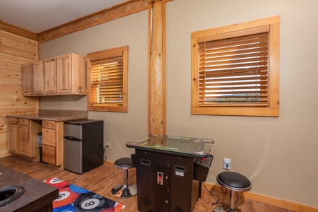 Arcade game table in the gameroom at Great View Lodge, a 5-bedroom cabin rental located in Pigeon Forge