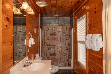 Bathroom with a tub and shower at 5 Star View, a 3 bedroom cabin rental located in Gatlinburg
