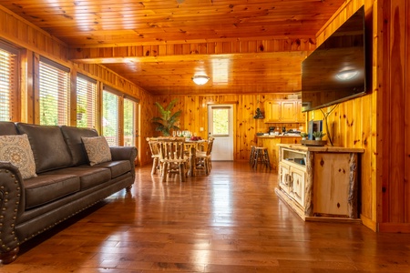 Living room and dining room table that seats 6 at 1 Crazy Cub, a 4 bedroom cabin rental located in Pigeon Forge