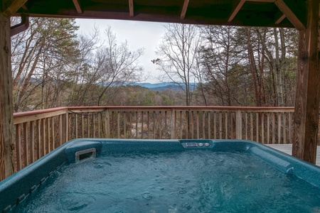 Hot tub and winter view at Beary Good Time, a 1-bedroom cabin rental located in Pigeon Forge