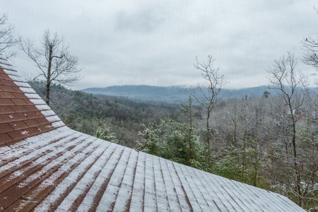 A dusting of snow and the Smoky Mountains at Alpine Romance, a 2 bedroom cabin rental located in Pigeon Forge