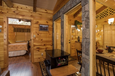 Arcade game in the living room at Rustic Ranch, a 2 bedroom cabin rental located in Pigeon Forge