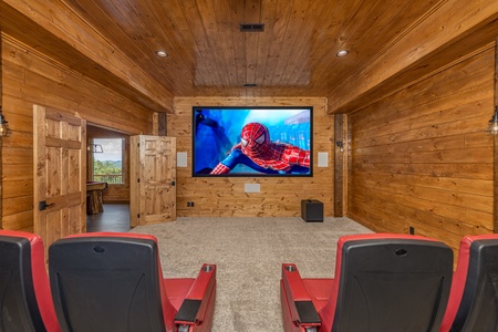 Home theater with seating for 18 at Black Bears & Biscuits Lodge, a 6 bedroom cabin rental located in Pigeon Forge