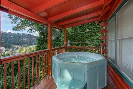 Round hot tub on the covered deck at Shiloh, a 3 bedroom cabin rental located in Gatlinburg