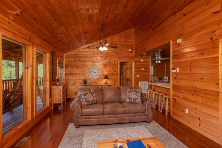 Sofa in the living room at Cabin Fever, a 4-bedroom cabin rental located in Pigeon Forge