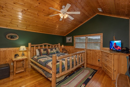 Loft bedroom with TV and dresser at Almost Bearadise, a 4 bedroom cabin rental located in Pigeon Forge