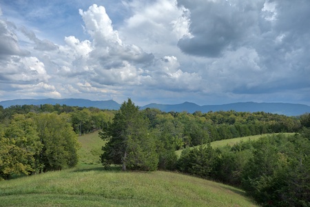 Mountain view from the deck at Cedar Creeks, a 2-bedroom cabin rental located near Douglas Lake