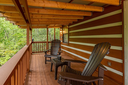 Deck seating at Copper Owl, a 2 bedroom cabin rental located in Pigeon Forge