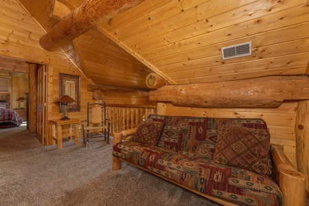 Futon in the loft at Grizzly's Den, a 5 bedroom cabin rental located in Gatlinburg