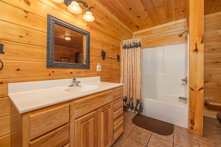 Bathroom with a tub and shower at Bears Don't Bluff, a 3 bedroom cabin rental located in Pigeon Forge