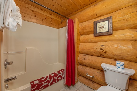 Bathroom with a tub and shower at Grizzly's Den, a 5 bedroom cabin rental located in Gatlinburg