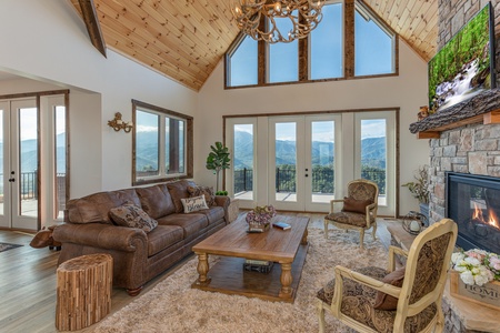 Living room with sofa, coffee table, and two chairs at Mountain Celebration, a 4 bedroom cabin rental located in Gatlinburg