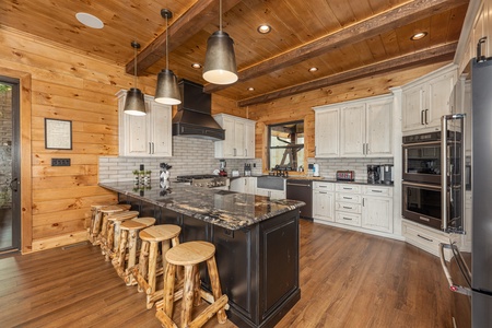 Breakfast bar with seating for five at Black Bears & Biscuits Lodge, a 6 bedroom cabin rental located in Pigeon Forge