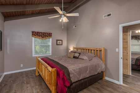 Log bed in a bedroom at Forever Country, a 3 bedroom cabin rental located in Pigeon Forge