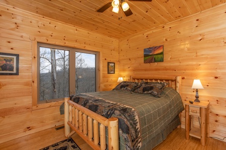 Bedroom with a log bed at Happy Bear's Hideaway, a 2 bedroom cabin rental located in Gatlinburg