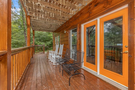 Seating on a deck at Wildlife Retreat, a 3 bedroom cabin rental located in Pigeon Forge
