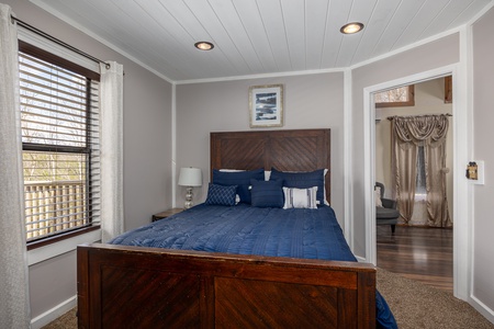 Bedroom with Nightstand at Hoop Dreams Lodge