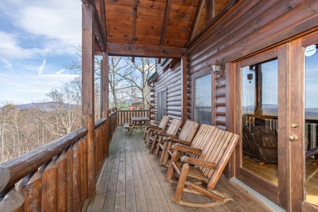Rocking chairs on a covered deck at 5 Star View, a 3 bedroom cabin rental located in Gatlinburg