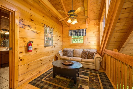 Loft seating at Moonbeams & Cabin Dreams, a 3 bedroom cabin rental located in Pigeon Forge