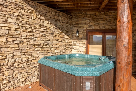 Hot tub on the lower deck at Grizzly's Den, a 5 bedroom cabin rental located in Gatlinburg
