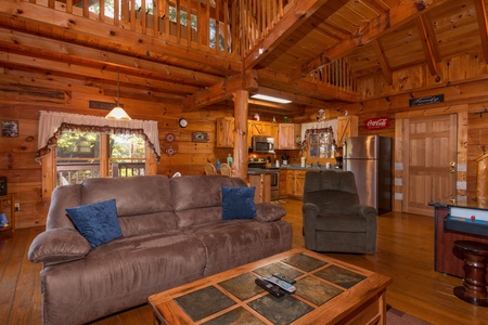 Sofa and chair in the living room at Hawk's Nest, a 1 bedroom cabin rental located in Pigeon Forge