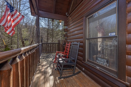 Front porch with rocking chairs at Nascar Nation, a 2 bedroom cabin rental located in Pigeon Forge