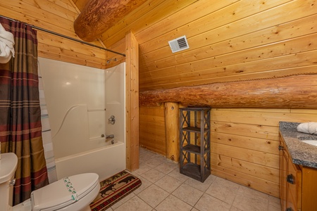 Bathroom with a tub and shower at Grizzly's Den, a 5 bedroom cabin rental located in Gatlinburg