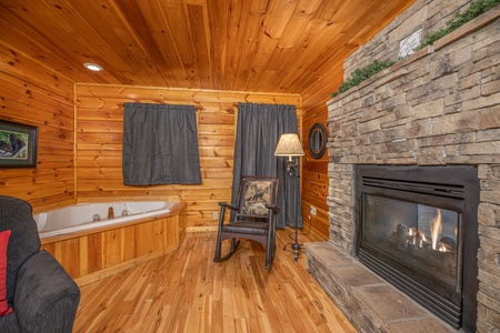 Jacuzzi and fireplace in a bedroom at Whispering Grace, a 2 bedroom cabin rental located in Gatlinburg
