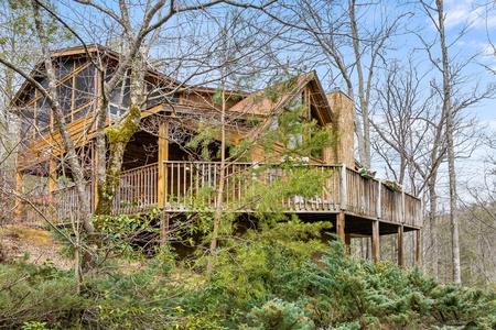 Alpine Romance, a 2 bedroom cabin rental located in Pigeon Forge with a dusting of snow