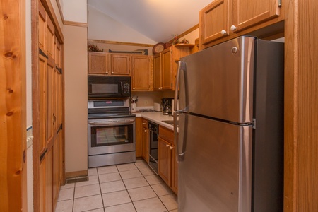 Kitchen with stainless appliances at Just for Fun, a 4 bedroom cabin rental located in Pigeon Forge