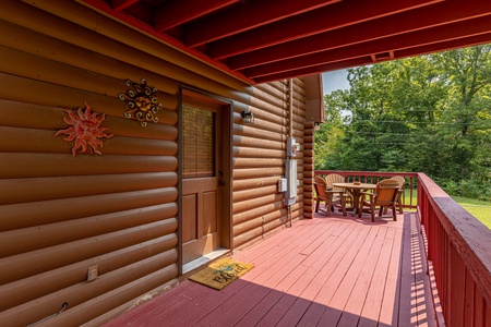 Deck dining for 4 at 1 Crazy Cub, a 4 bedroom cabin rental located in Pigeon Forge