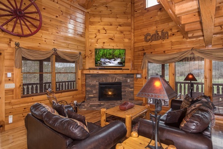 Living room with fireplace and TV at Mountain View Meadows, a 3 bedroom cabin rental located in Pigeon Forge