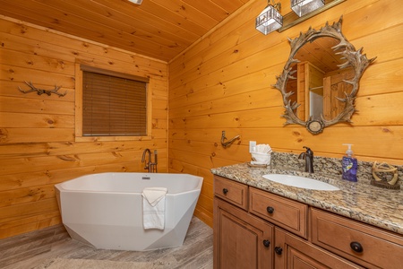 Soaking tub in a bathroom at J's Hideaway, a 4 bedroom cabin rental located in Pigeon Forge