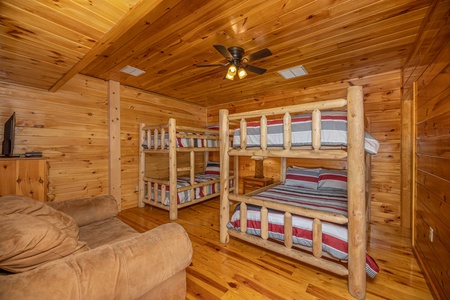 Room with four bunks at Hickernut Lodge, a 5-bedroom cabin rental located in Pigeon Forge