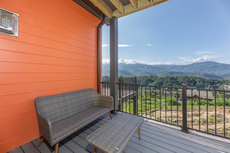 Deck seating off the bedroom at Mountain Celebration, a 4 bedroom cabin rental located in Gatlinburg