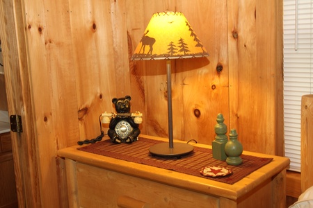 Bedroom decor at Bearfoot Crossing, a 1-bedroom cabin rental located in Pigeon Forge