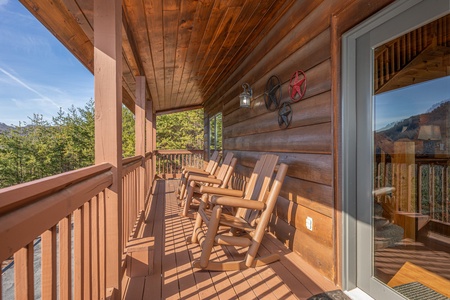 Rocking Chairs on Covered Deck at Mountain Mama, a 3 bedroom cabin rental located in pigeon forge