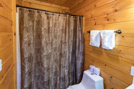 Bathroom with a tub and shower at Four Seasons Palace, a 5-bedroom cabin rental located in Pigeon Forge