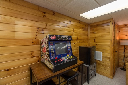 Table top arcade game at Kelly's Cabin, a 1 bedroom cabin rental located in Pigeon Forge