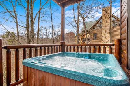 First floor deck with hot tub at Natural Wonder, a 4 bedroom cabin rental located in Gatlinburg