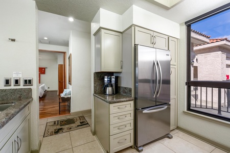 Full kitchen with modern appliances and granite countertops