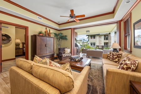 Sink into plush seating in your beautifully appointed living room, where tropical breezes and balcony views invite you to unwind in island-inspired comfort.