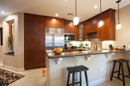 - Fully equipped kitchen with stainless steel appliances, granite countertops, and custom cabinets - Sit at the breakfast bar with your coffee or prep for group meals with ease - Everything you need is within reach in this sleek and modern setup