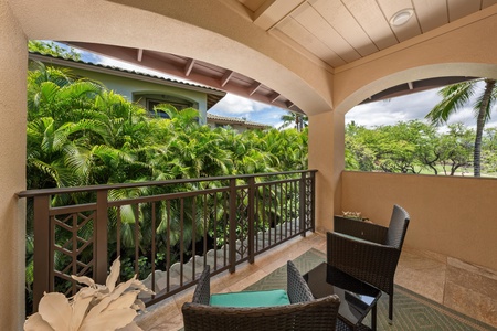- Private covered balcony with two wicker chairs and small table - Surrounded by beautiful tropical palms for privacy and a serene view - Perfect spot for morning coffee or evening relaxation outdoors