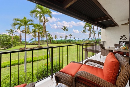 - Enjoy stunning palm lined views from this shaded lanai with plush seating - Cozy up on cushioned wicker chairs and soak in the breeze and tropical charm - Peaceful spot for morning coffee or sunset drinks with beautiful green surroundings