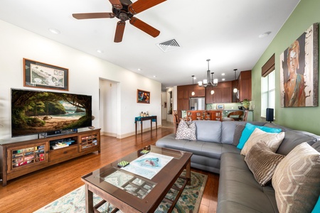 Catch your favorite show on the flat screen TV from the oversized sofa.