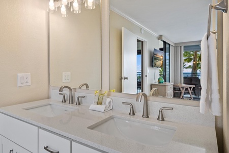 - Get ready in style with two deep sinks, modern fixtures, and sparkling lighting - Full mirror opens up the room while offering peekaboo views of the ocean - Thoughtful amenities and elegant details enhance every stay