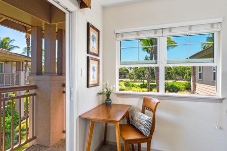 Primary bedroom with king bed and work station