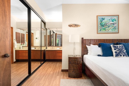 Drift off in your serene bedroom suite with rich wood accents and an en-suite bathroom just steps away through elegant sliding doors.